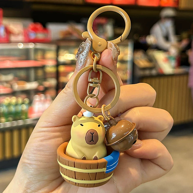 Eastcoco Baby capybara taking a bath keychain